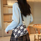 Damska torba crossbody z wieloma kieszeniami i nadrukiem