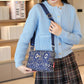 Damska torba crossbody z wieloma kieszeniami i nadrukiem