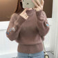 Gruby sweter z dzianiny z haftem kwiatowym